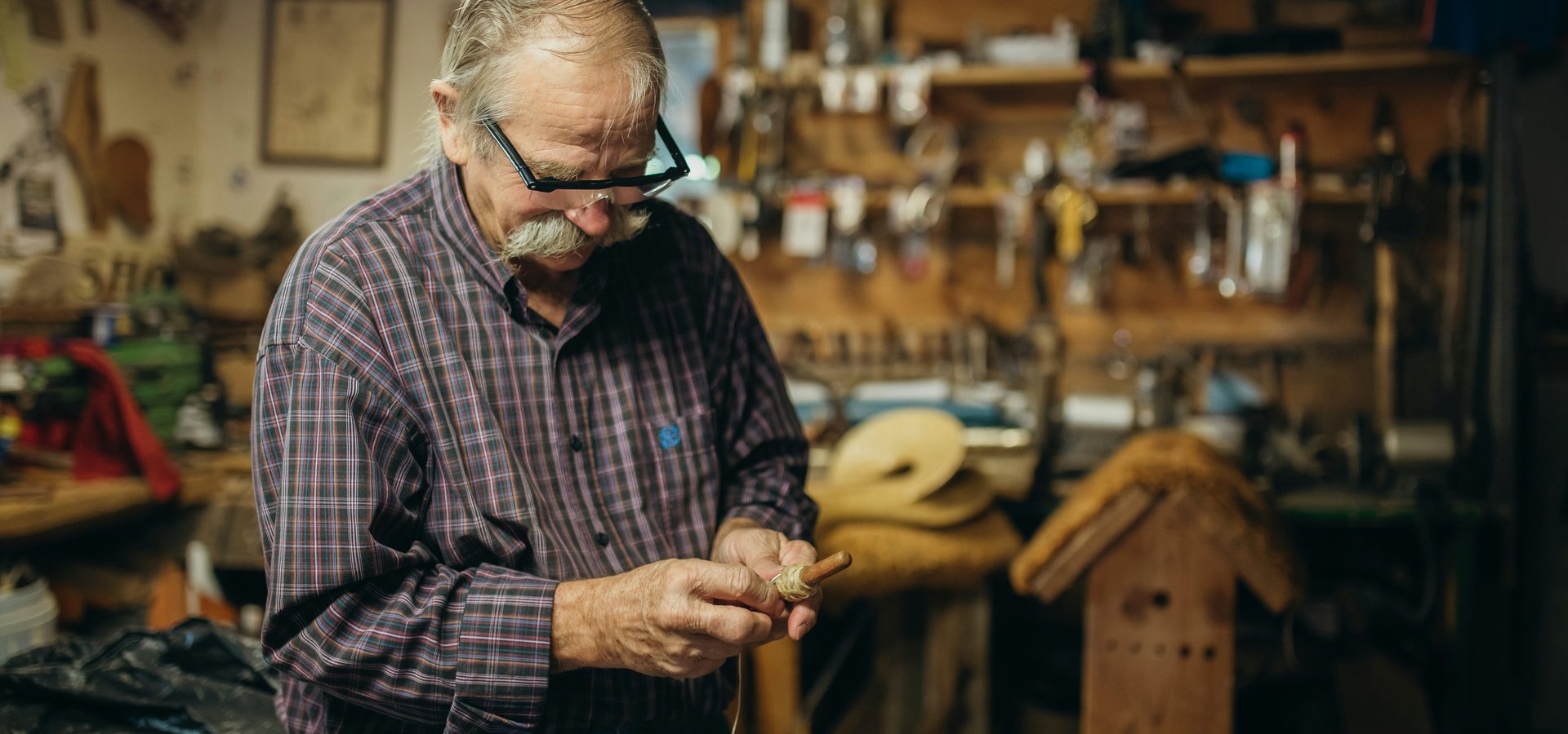 A craftsman focused on his work in his workshop